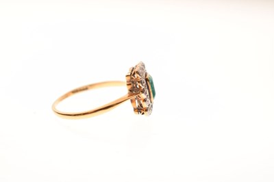 Lot 18 - Emerald and diamond 18ct yellow gold cluster ring