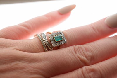 Lot 18 - Emerald and diamond 18ct yellow gold cluster ring