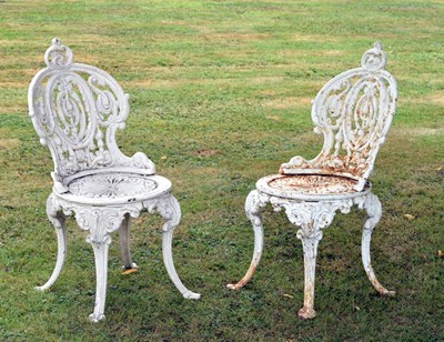 Lot 752 - Pair of late 19th / 20th century Coalbrookdale style cast iron terrace/patio chairs