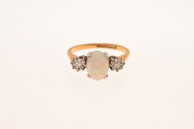 Lot 25 - Opal and diamond three-stone ring