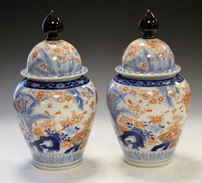 Lot 634 - Pair of Japanese Imari jars and covers
