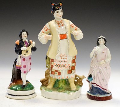 Lot 457 - Russian Lomonosov figure, and two others