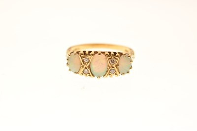 Lot 24 - Opal and diamond 18ct gold ring