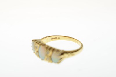 Lot 24 - Opal and diamond 18ct gold ring
