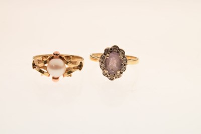 Lot 42 - Amethyst and diamond cluster ring and a cultured pearl yellow metal dress ring