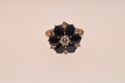 Lot 30 - Sapphire and diamond 18ct gold flower cluster ring