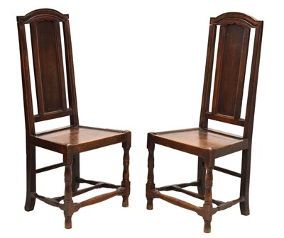 Lot 476 - Pair of early 18th century oak hall chairs