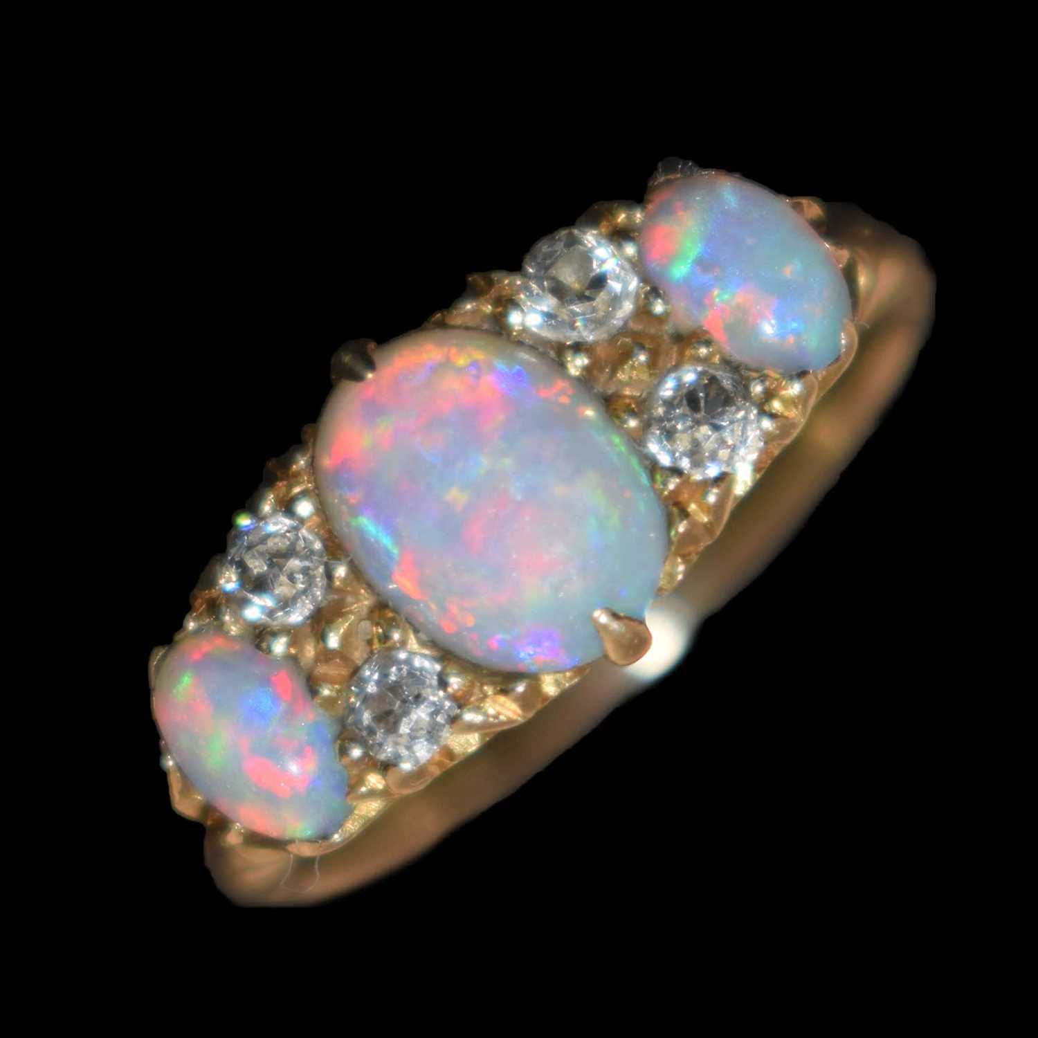 Lot 22 - Edwardian opal and diamond 18ct gold boat cluster ring