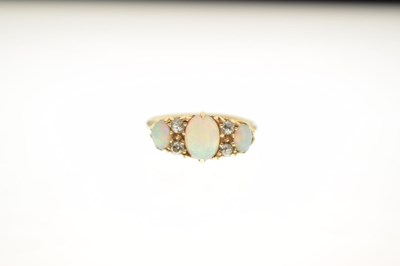 Lot 22 - Edwardian opal and diamond 18ct gold boat cluster ring