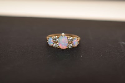 Lot 22 - Edwardian opal and diamond 18ct gold boat cluster ring