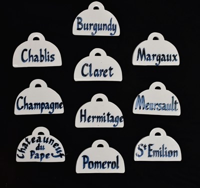 Lot 497 - Set of ten 20th century ceramic wine bin labels