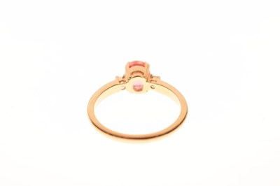 Lot 39 - Orange sapphire and diamond 18ct gold ring