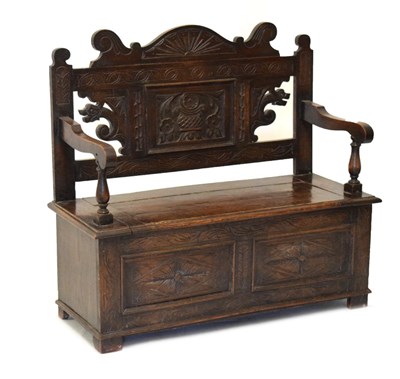 Lot 798 - Early 20th Century carved dark oak hall seat