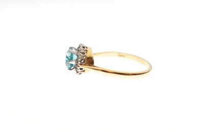 Lot 37 - Blue topaz-coloured stone and diamond cluster 18ct gold ring
