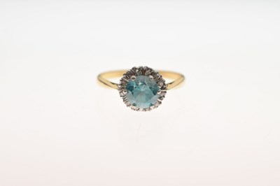 Lot 37 - Blue topaz-coloured stone and diamond cluster 18ct gold ring