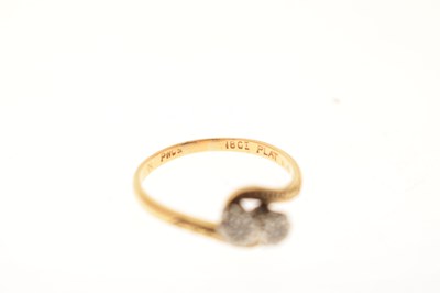 Lot 15 - Two-stone crossover illusion set diamond ring