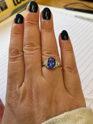 Lot 15 - Tanzanite and diamond 18ct white gold ring