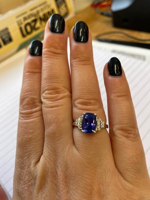 Lot 15 - Tanzanite and diamond 18ct white gold ring