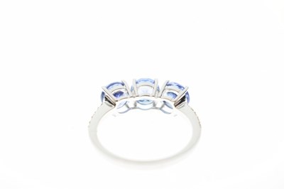 Lot 57 - 18ct white gold, three tanzanite ring