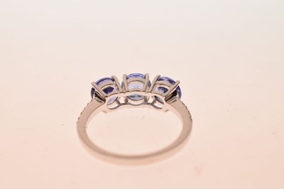 Lot 57 - 18ct white gold, three tanzanite ring