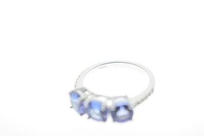 Lot 57 - 18ct white gold, three tanzanite ring