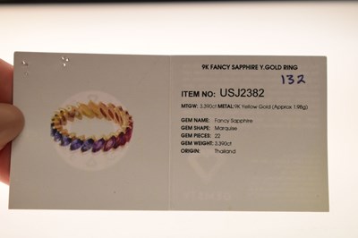 Lot 55 - 9K yellow metal and fancy sapphire full eternity ring