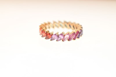 Lot 55 - 9K yellow metal and fancy sapphire full eternity ring