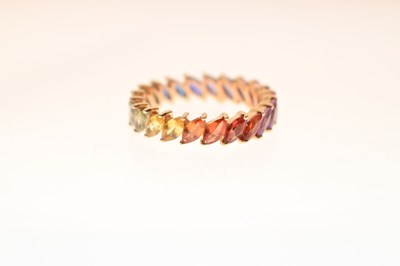 Lot 55 - 9K yellow metal and fancy sapphire full eternity ring
