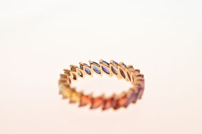 Lot 55 - 9K yellow metal and fancy sapphire full eternity ring