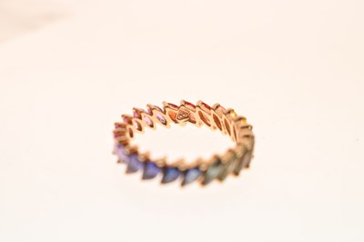 Lot 55 - 9K yellow metal and fancy sapphire full eternity ring