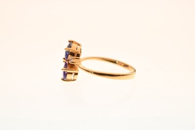 Lot 29 - Two-stone tanzanite and diamond 18ct gold crossover dress ring