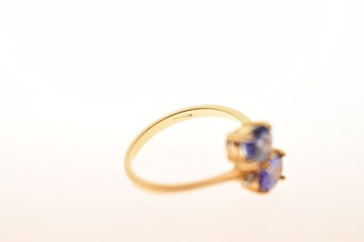 Lot 29 - Two-stone tanzanite and diamond 18ct gold crossover dress ring