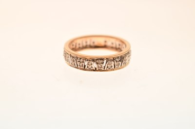 Lot 23 - 9ct yellow and white gold diamond set band