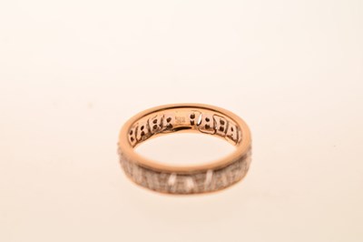 Lot 23 - 9ct yellow and white gold diamond set band