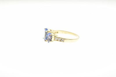 Lot 24 - Tanzanite and diamond 18ct gold ring