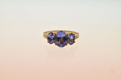 Lot 24 - Tanzanite and diamond 18ct gold ring