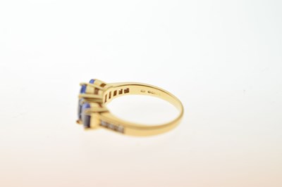 Lot 24 - Tanzanite and diamond 18ct gold ring