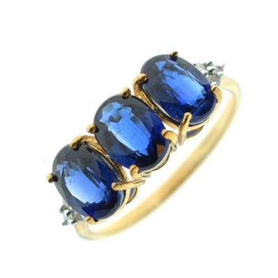 Lot 83 - Two 9ct gold dress rings, each set three blue stones