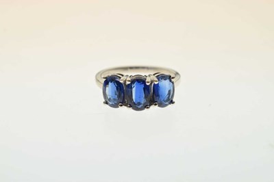 Lot 83 - Two 9ct gold dress rings, each set three blue stones