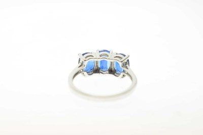 Lot 83 - Two 9ct gold dress rings, each set three blue stones