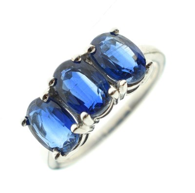 Lot 83 - Two 9ct gold dress rings, each set three blue stones