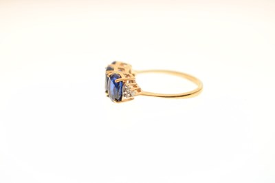 Lot 83 - Two 9ct gold dress rings, each set three blue stones