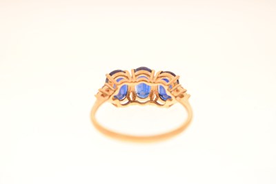 Lot 83 - Two 9ct gold dress rings, each set three blue stones