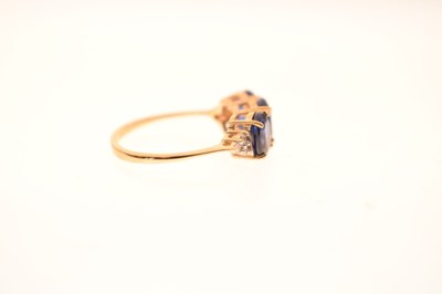 Lot 83 - Two 9ct gold dress rings, each set three blue stones