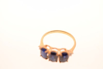 Lot 83 - Two 9ct gold dress rings, each set three blue stones