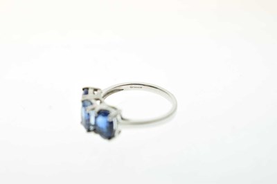 Lot 83 - Two 9ct gold dress rings, each set three blue stones