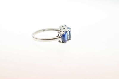 Lot 83 - Two 9ct gold dress rings, each set three blue stones