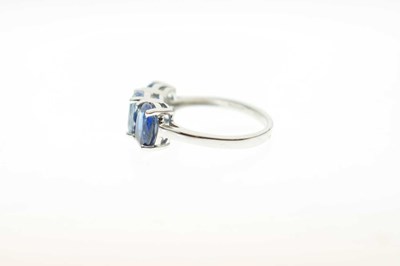 Lot 83 - Two 9ct gold dress rings, each set three blue stones