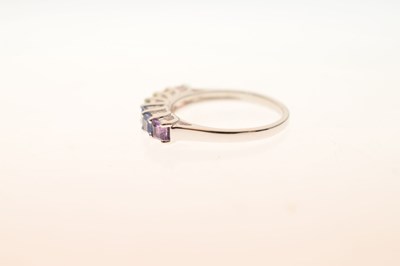 Lot 71 - Fancy coloured sapphire seven-stone 9ct white gold ring