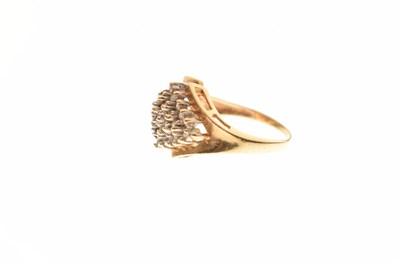 Lot 12 - Diamond cluster yellow metal ring